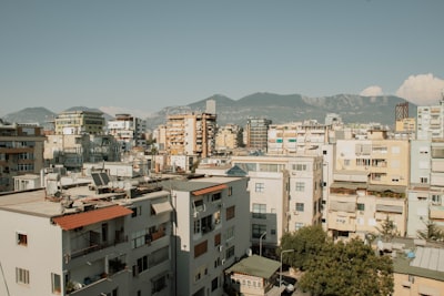 A view of a city with mountains in the background