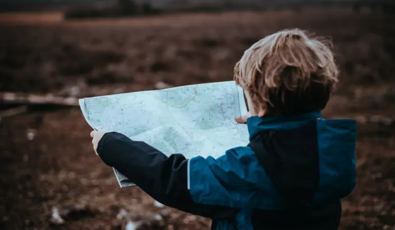 child looking at map